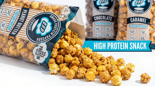 high-protein-popcorn-bag-with-popcorn-spilling-on-white-surface