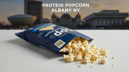 hero-image-of-high-protein-popcorn-bag-with-spilled-kernels-albany-ny-theme