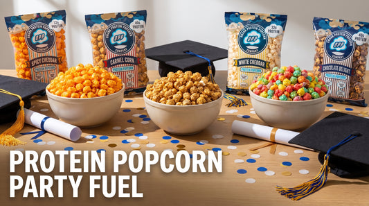 graduation-party-table-with-bowls-of-protein-popcorn-and-decorations