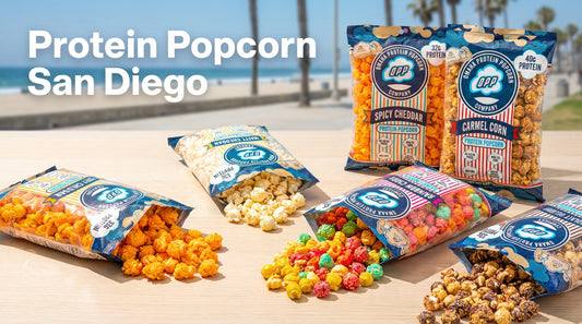 high protein popcorn bags with popcorn and san diego beach background