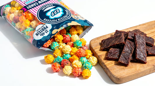 protein-popcorn-vs-jerky-high-protein-snack-comparison-on-clean-white-background