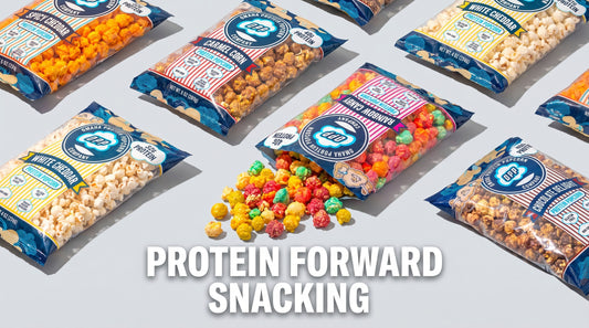 high-protein-omaha-protein-popcorn-bags-with-popcorn-on-clean-background
