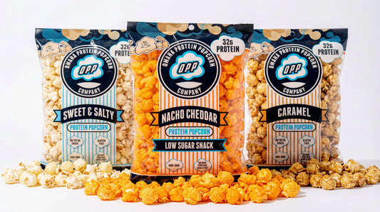 hero-image-of-low-sugar-protein-popcorn-with-spilled-popcorn