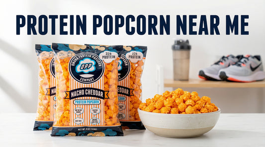 high-protein-popcorn-bags-and-bowl-on-clean-white-surface