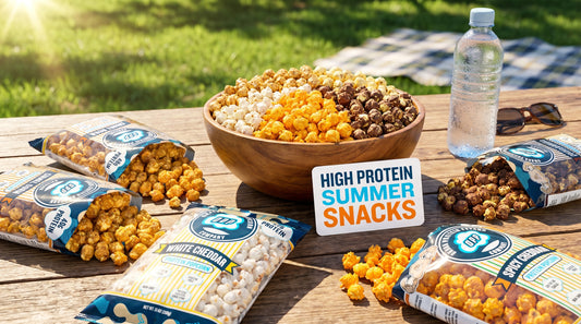 summer-protein-popcorn-snack-scene-with-bowl-and-bags-on-picnic-table