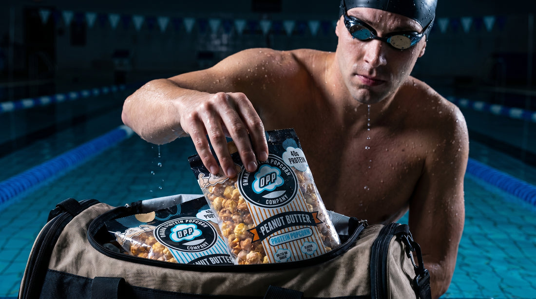 swimmer-grabbing-protein-popcorn-from-gym-bag-poolside